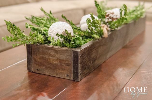 wood box, greenery, white vintage ornaments, pottery bard tahoe plaid table runner, pottery barn benchwright coffee table