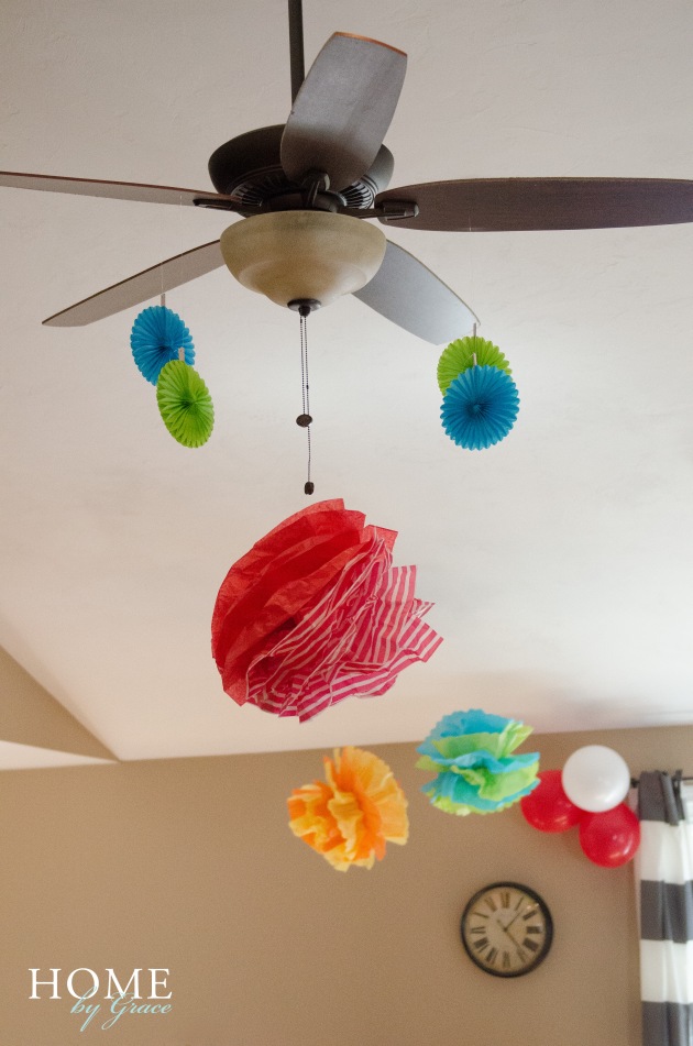 dr seuss birthday party decorations in kitchen dining area with tissue pom poms